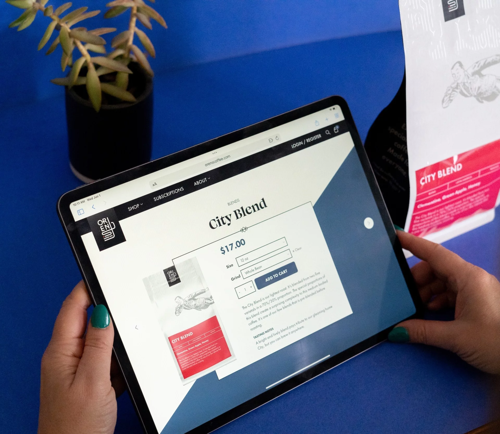 An iPad showing the DJ Disarray website, along with other artwork