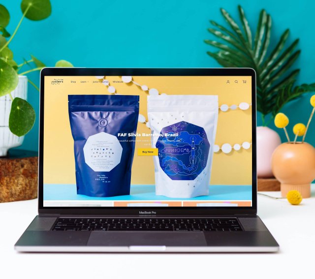 Home page of Junior's Roasted Coffee website featuring vibrant photography