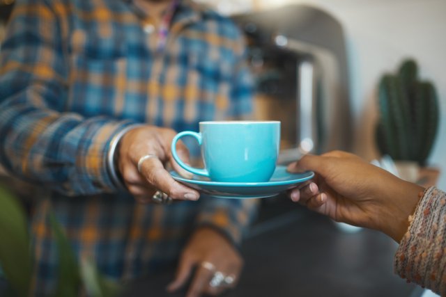 Customer service, cafe and hands of people with coffee for drinking, breakfast or lunch in restaurant