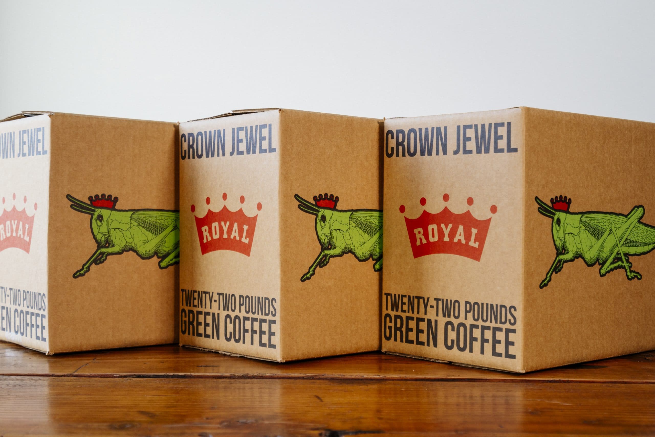A trio of Royal Coffee Crown Jewel boxes showcasing the refreshed identity