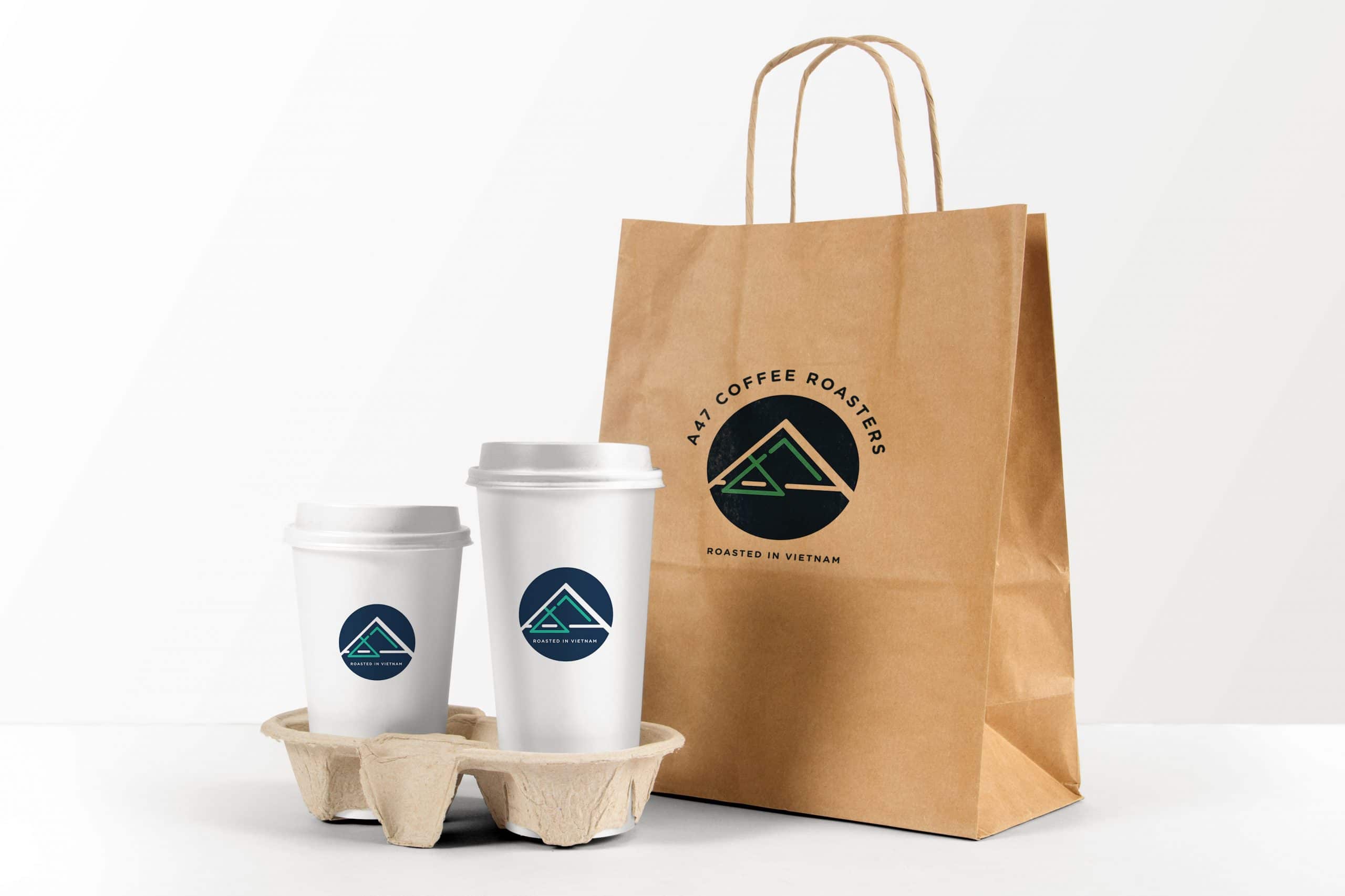 A mockup of the new A47 logo on to-go cups and bag