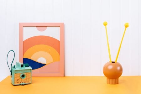 Playful lifestyle with a camera, poster and mallets