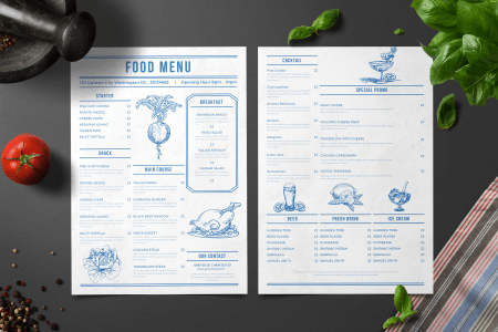 photo of a sample food menu surrounded by ingredients such as basil and tomato