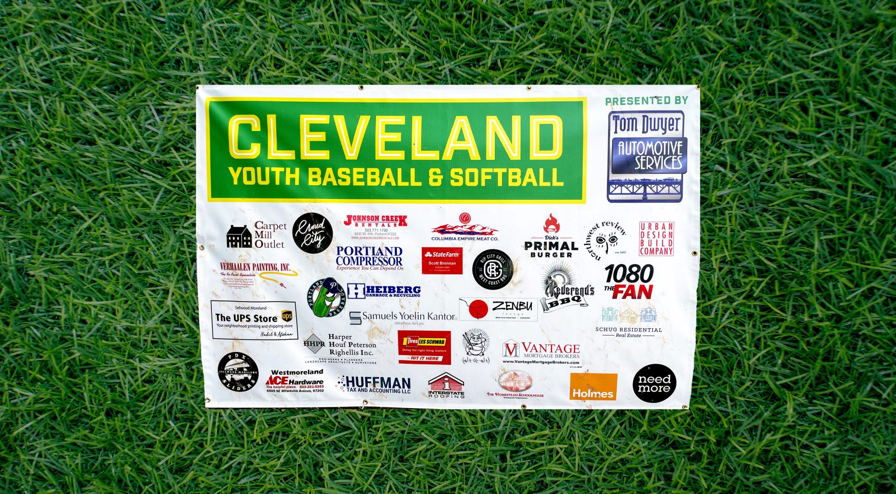 Banner with all of the CYBS sponsors listed, including Tom Swyer Automotive Services, Neemdore Designs, Cloud City Ice Cream, Primal Burger, and other local businesses.