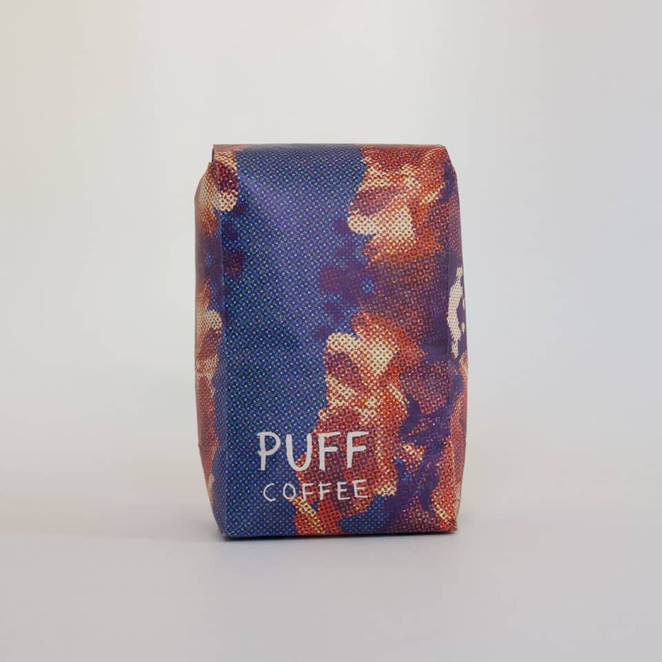 A Puff Coffee bag on white background