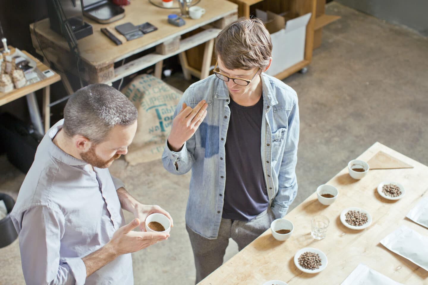 Two people getting ready to cup coffee